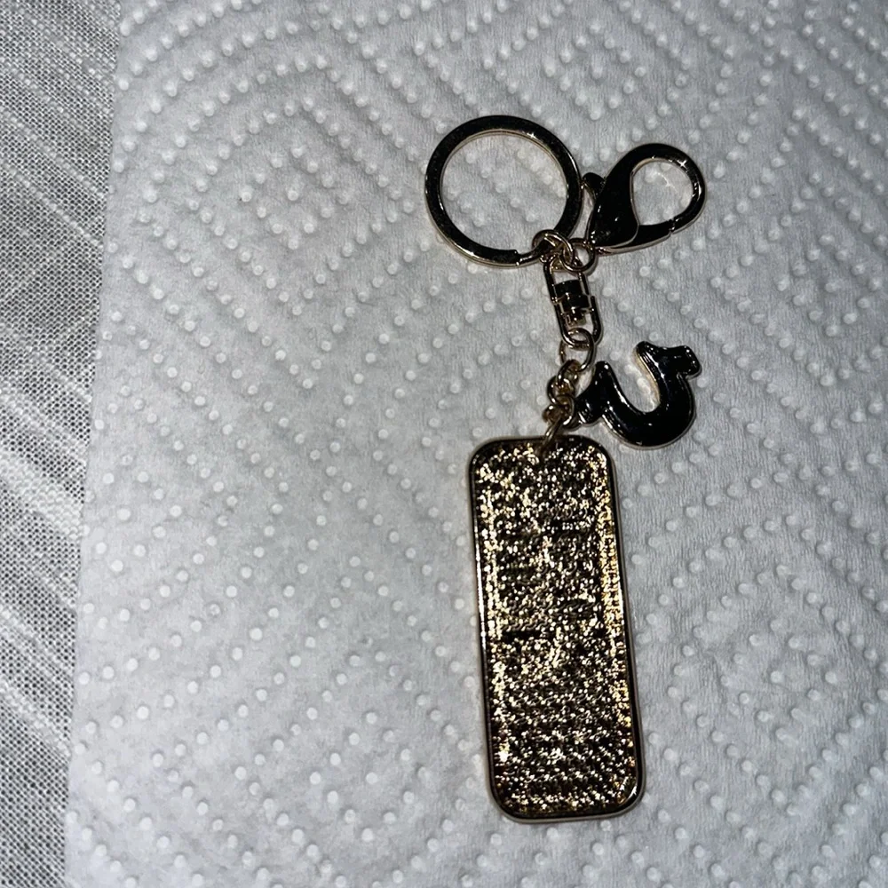 True Religion Gold and Black Keychain NEW